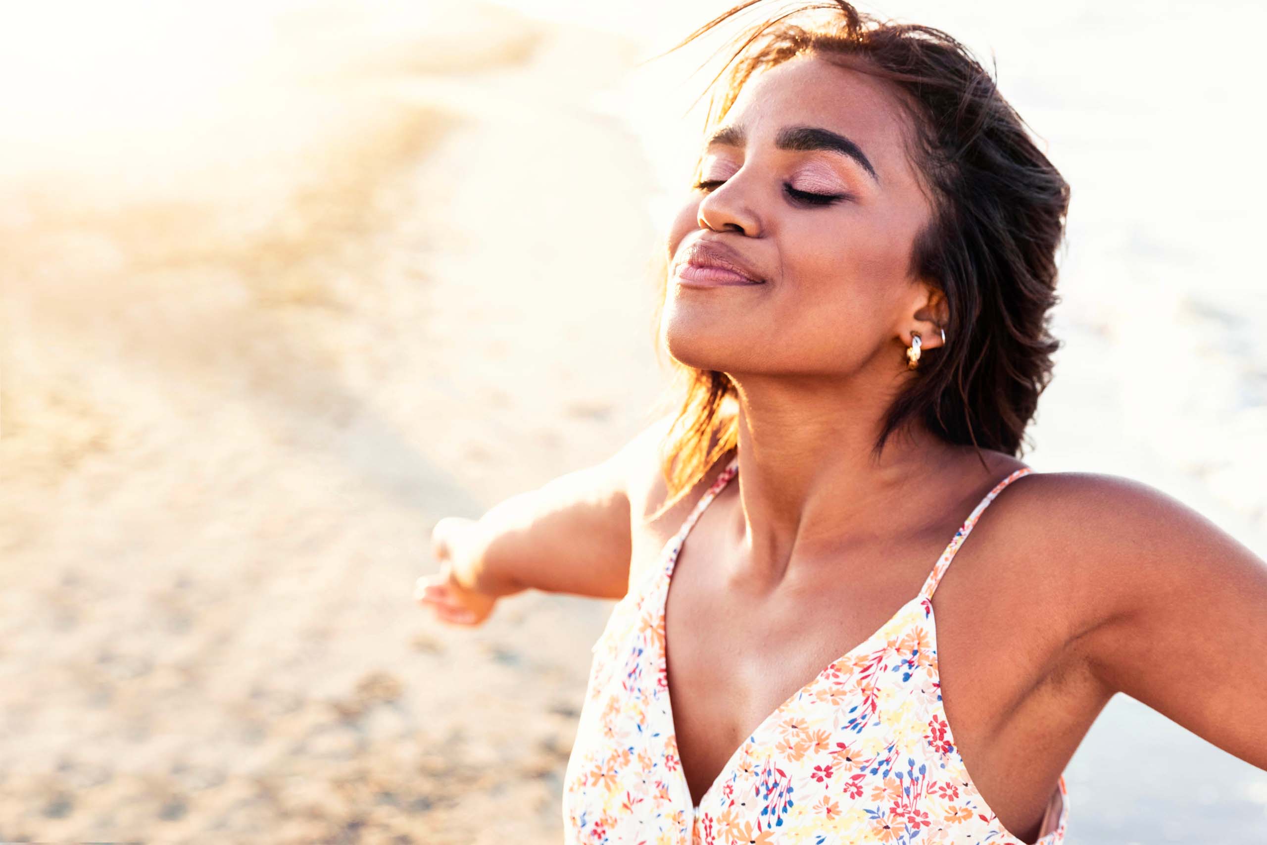 Woman with arms outstretched enjoying being herself.