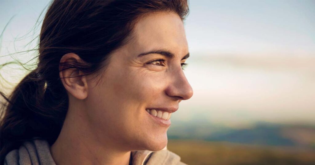 Woman looking off to the side out in nature