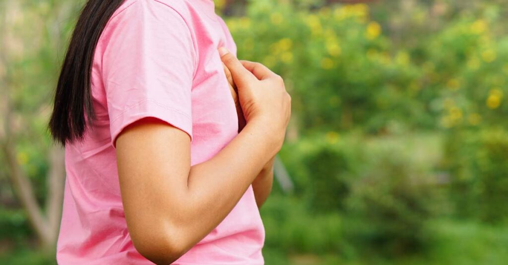 Woman hands on heart sensing